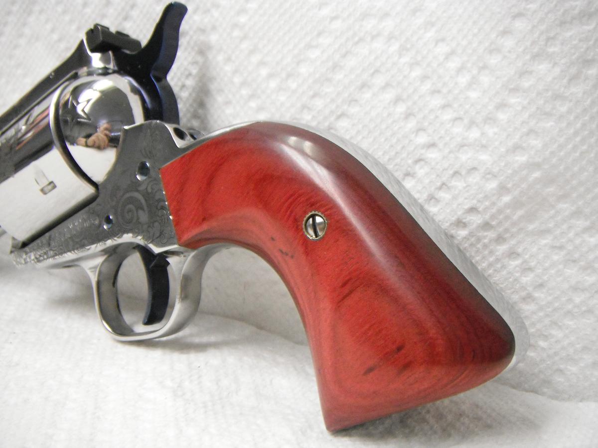 A red wooden gun is sitting on the table
