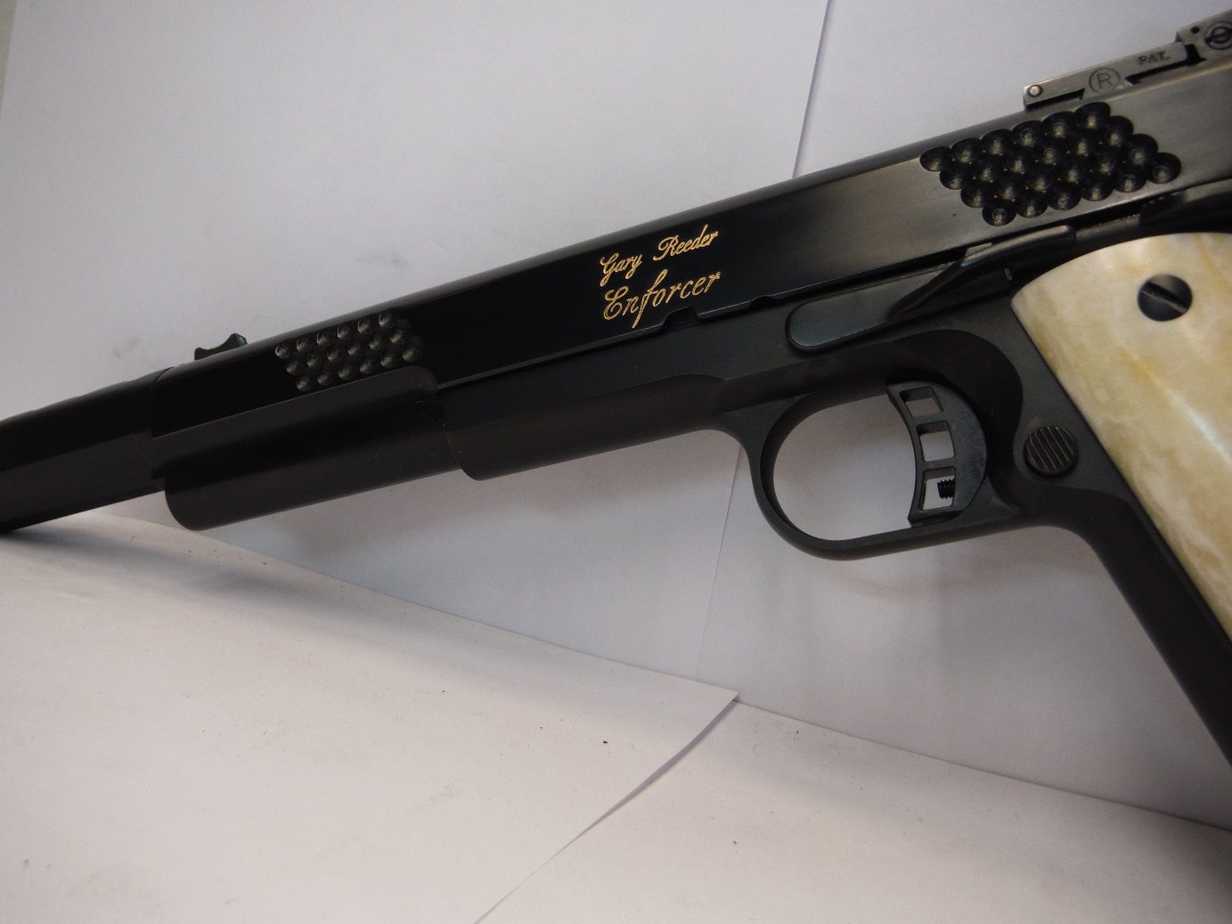 A close up of the side of a gun