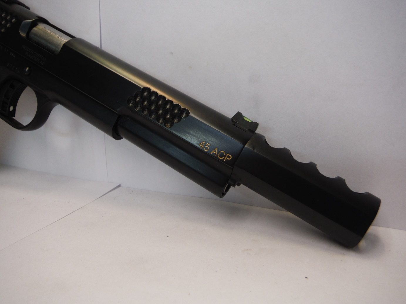 A close up of the side of a gun