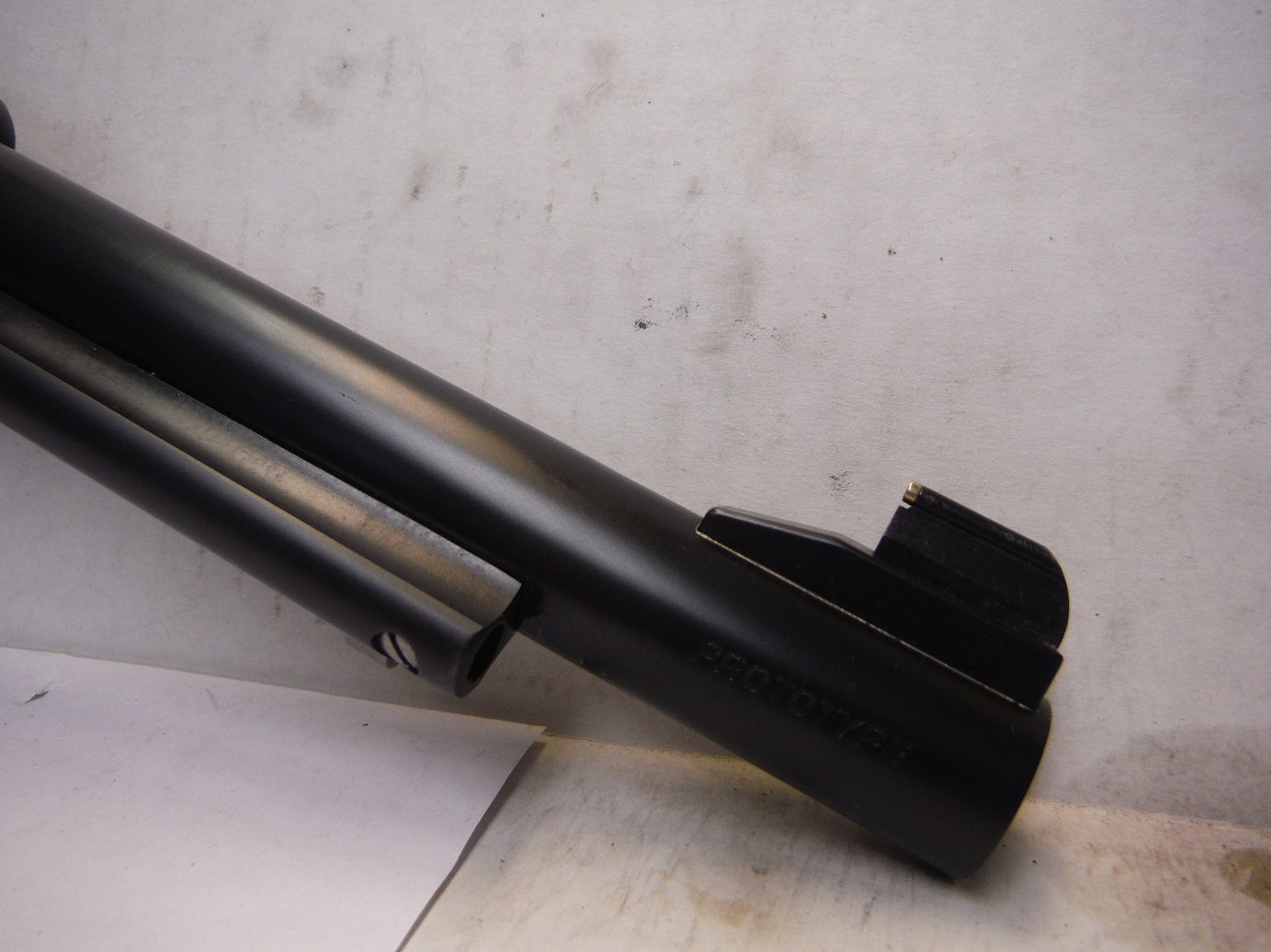 A close up of the barrel on a rifle