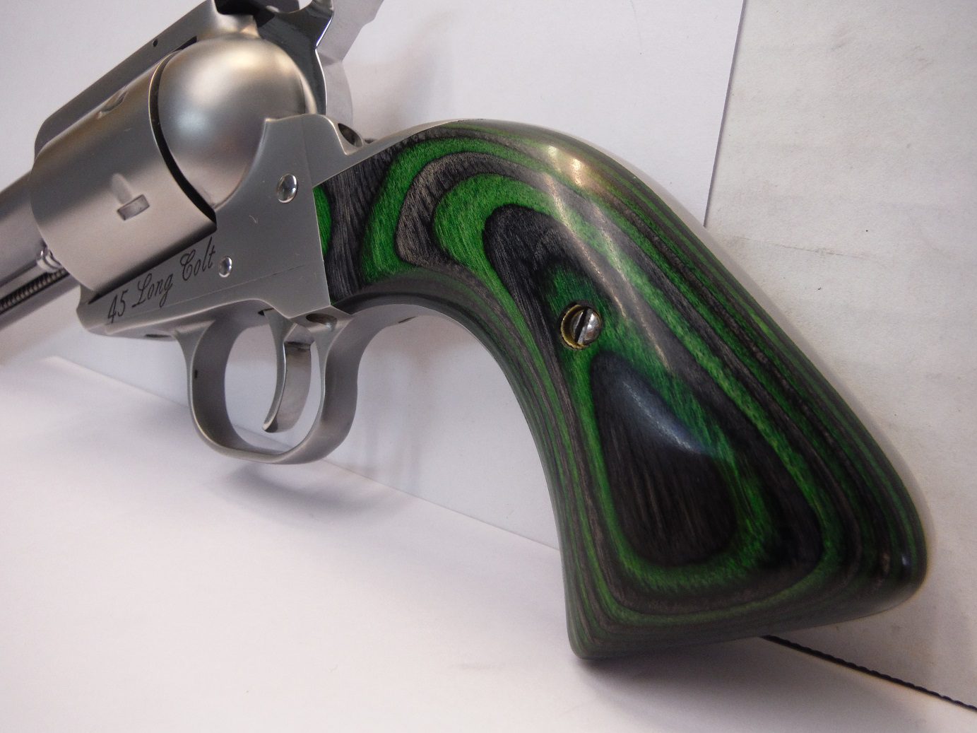 A gun that is sitting on top of a table.