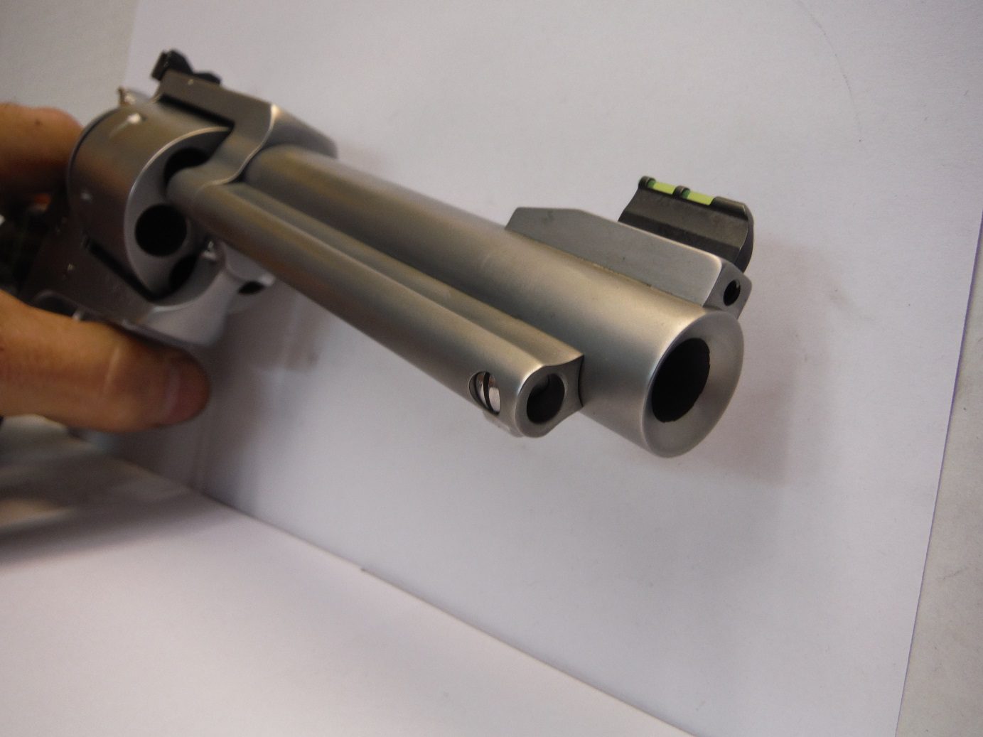 A gun that is hanging on the wall.