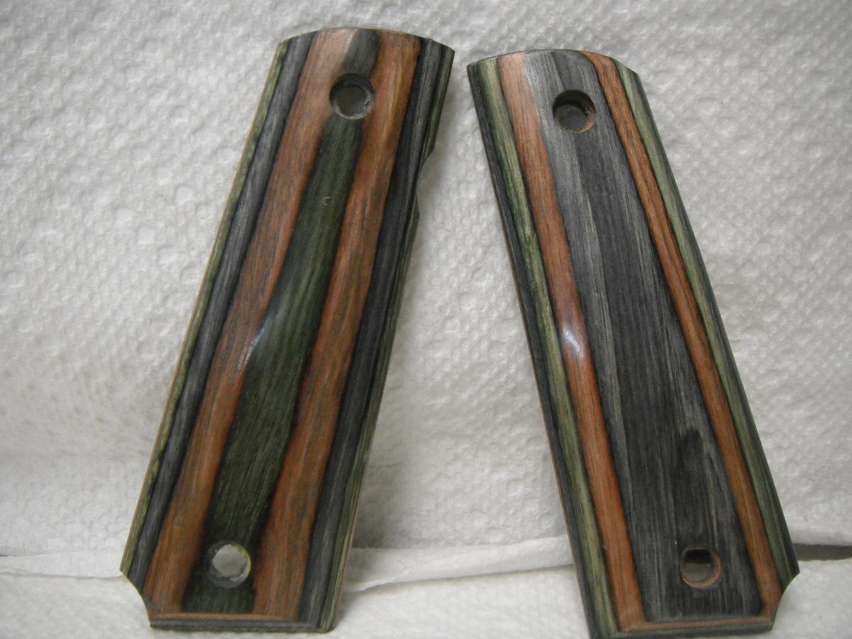 A pair of wooden grips for a gun.