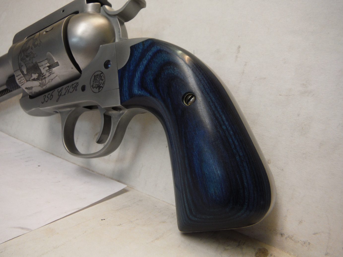 A gun that is sitting on the ground.