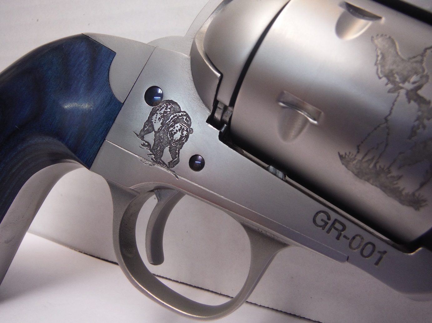 A close up of the side of a gun
