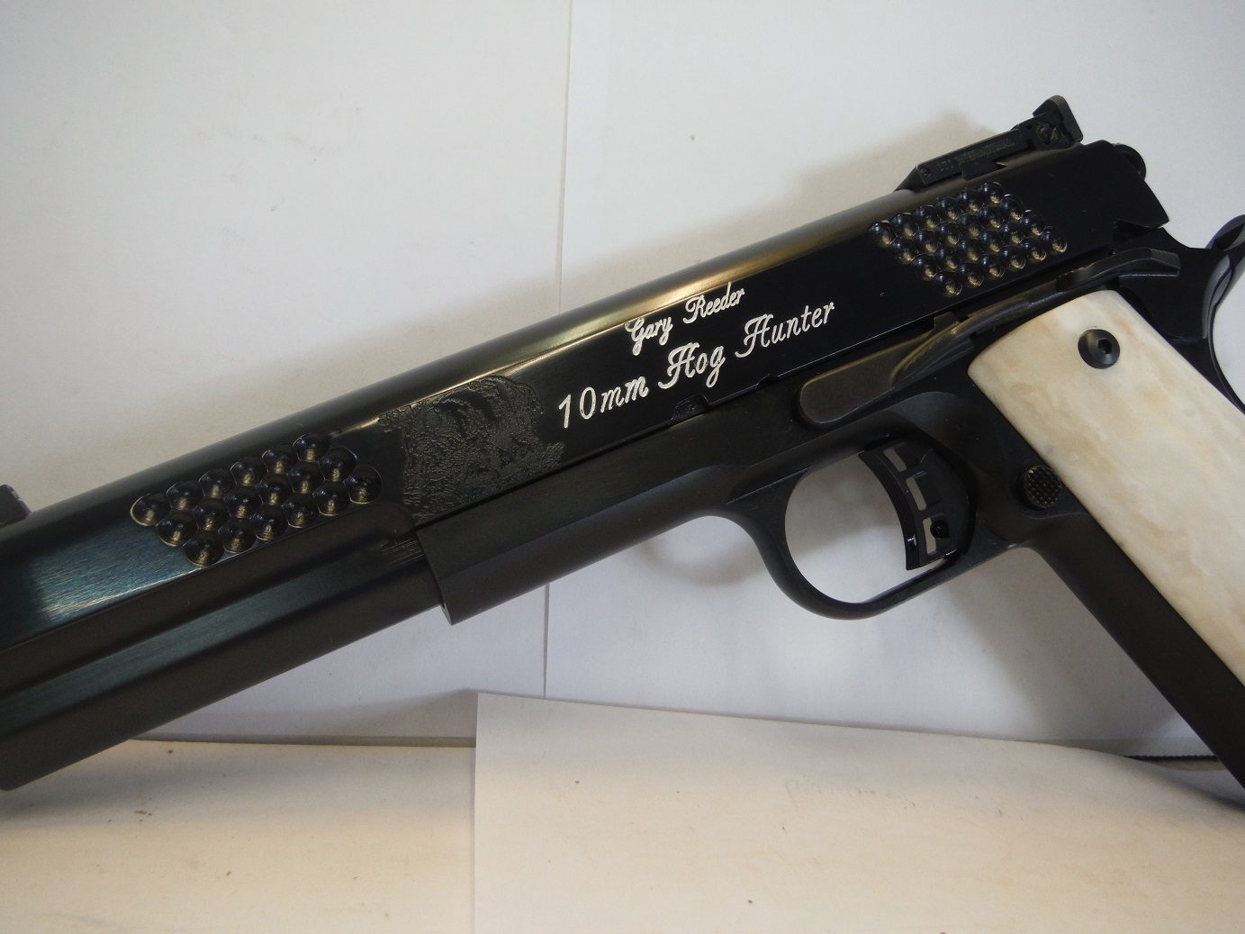 A black and white gun with a message on it.