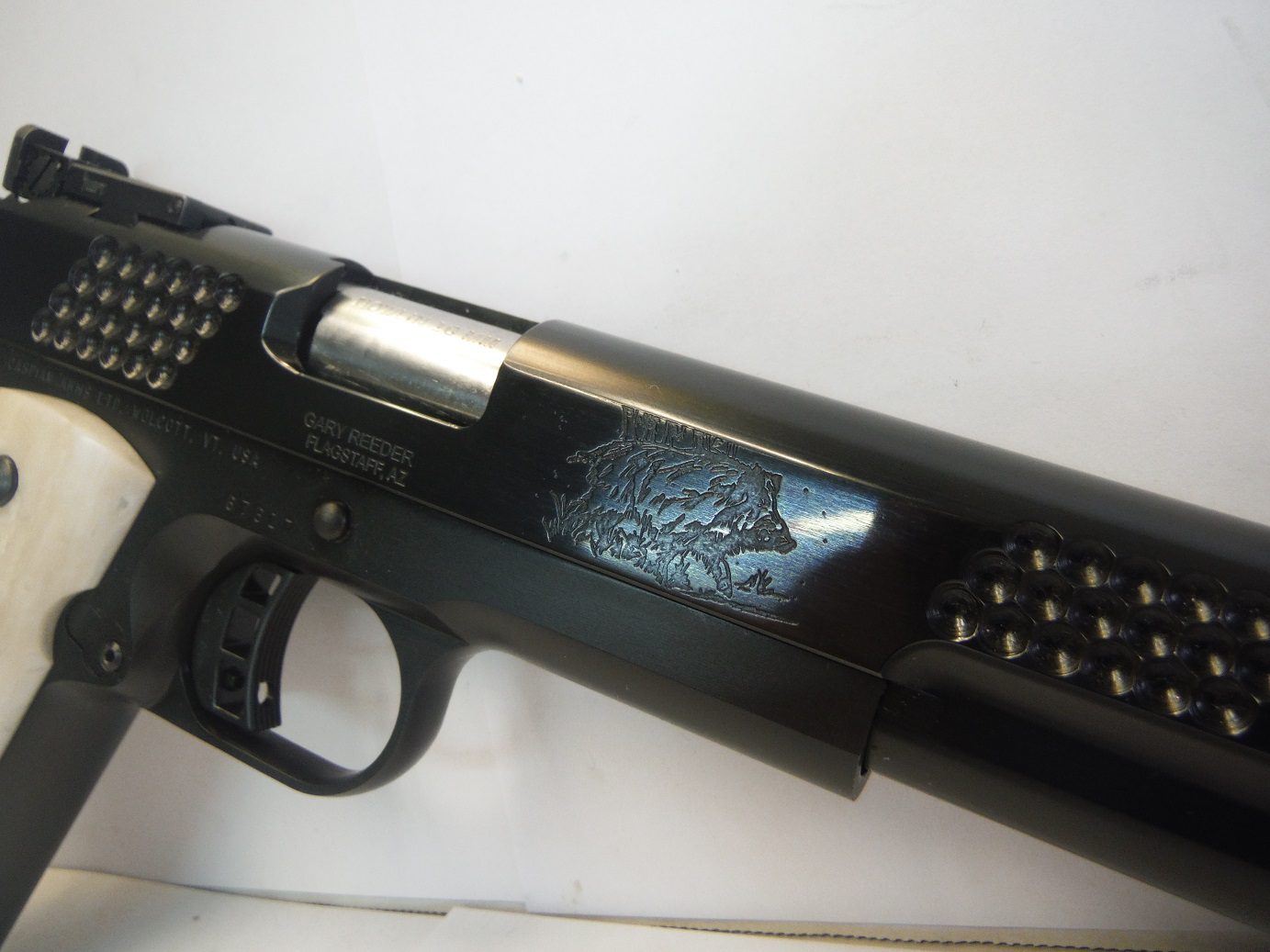 A close up of the side of a gun