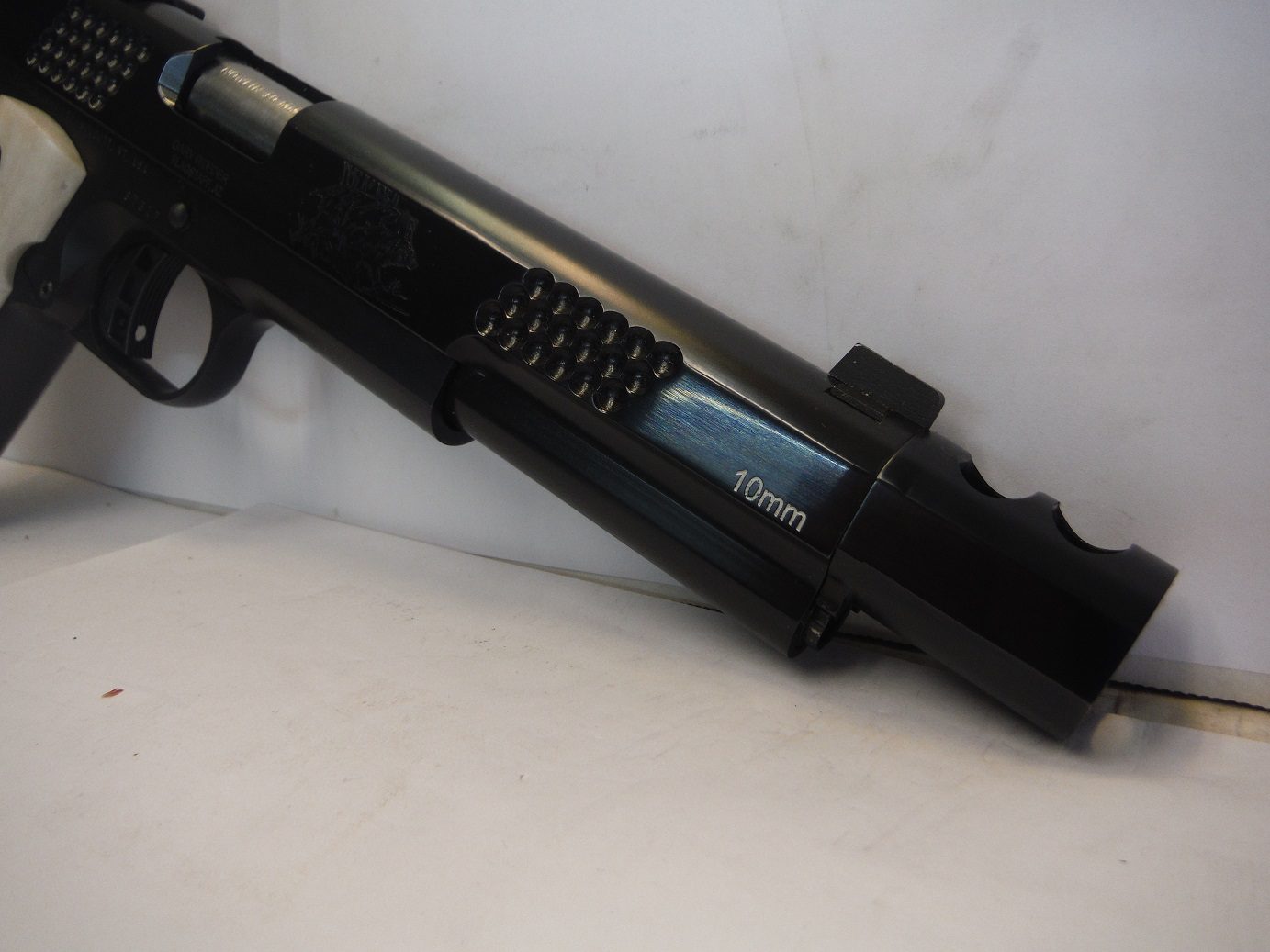 A close up of the side of a rifle