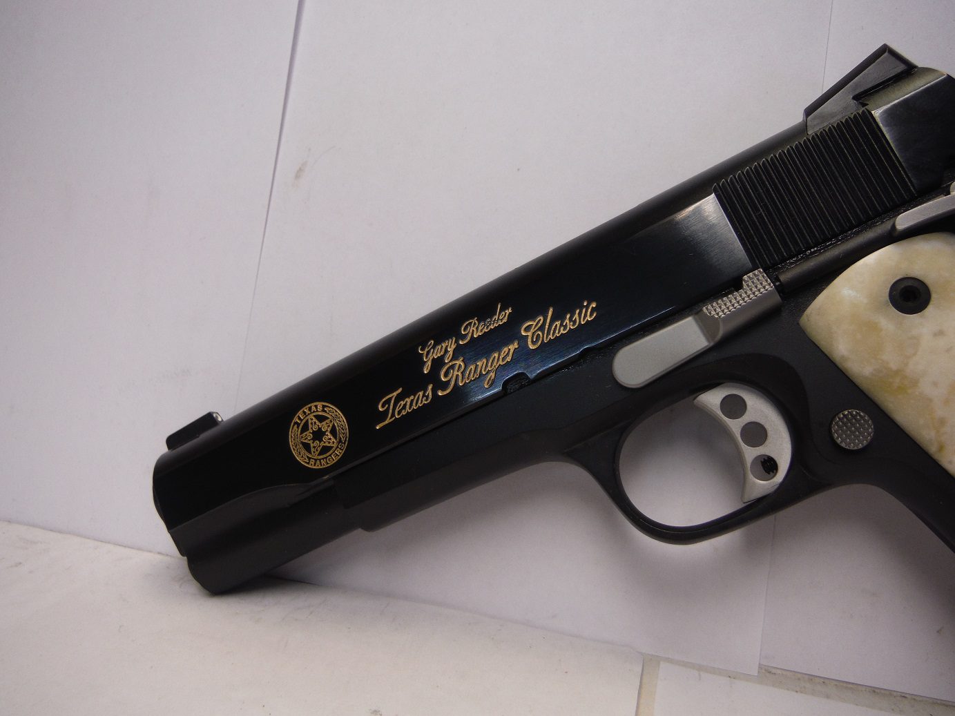 A close up of the side of a gun