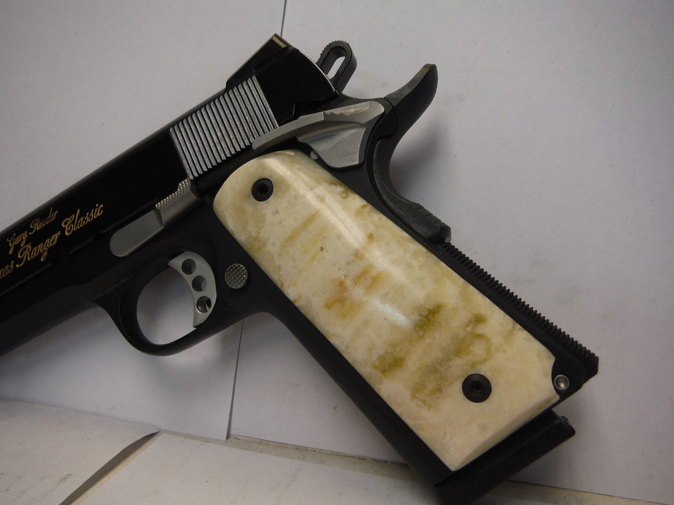 A gun that is laying on the floor.