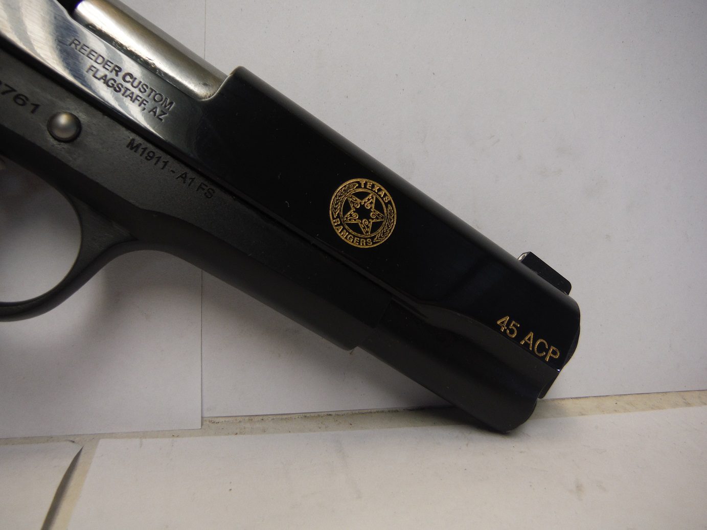 A close up of the side of a gun