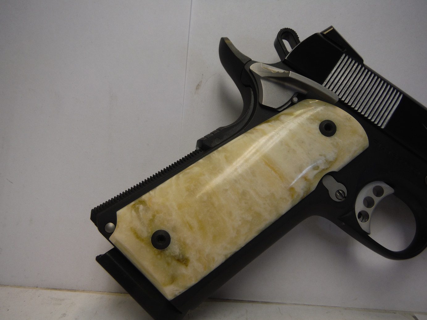 A gun that is laying on the ground.
