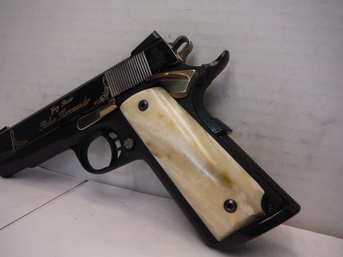 A gun that is sitting on top of a table.