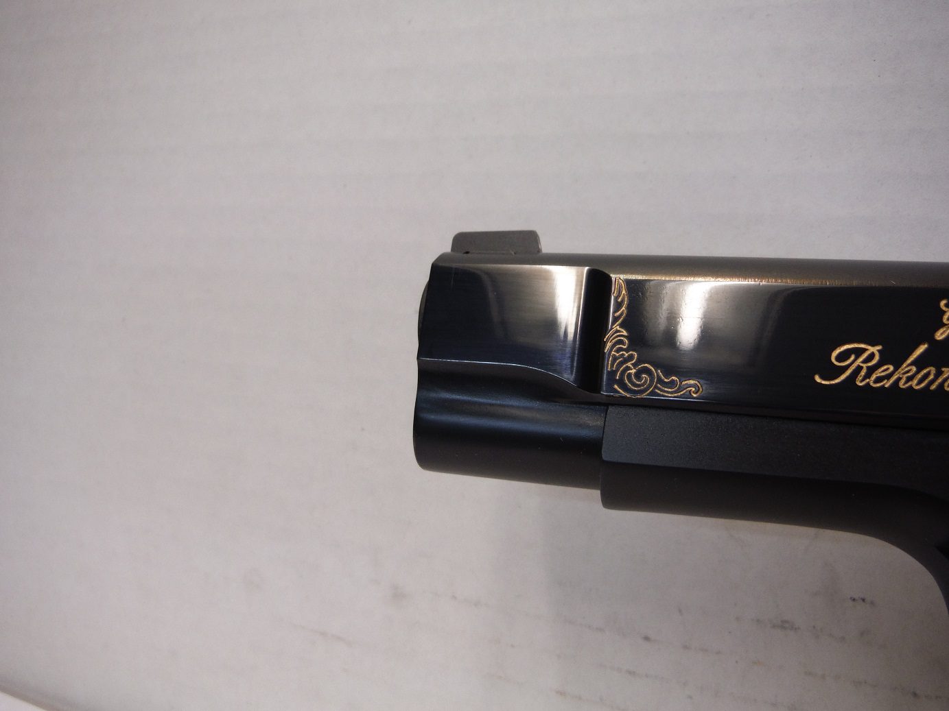 A close up of the top of a gun
