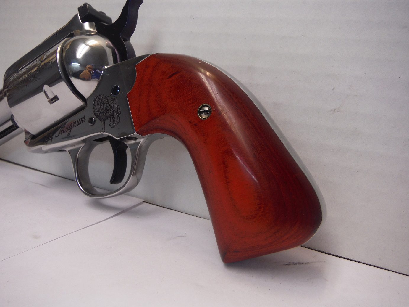 A gun that is leaning against the wall