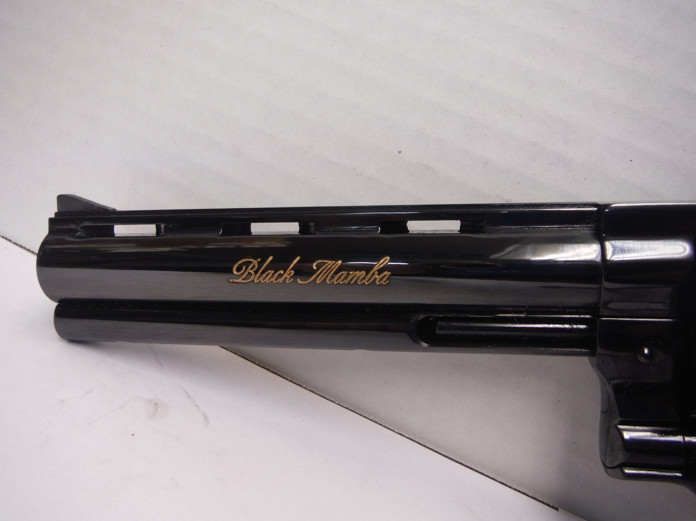 A close up of the side of a gun