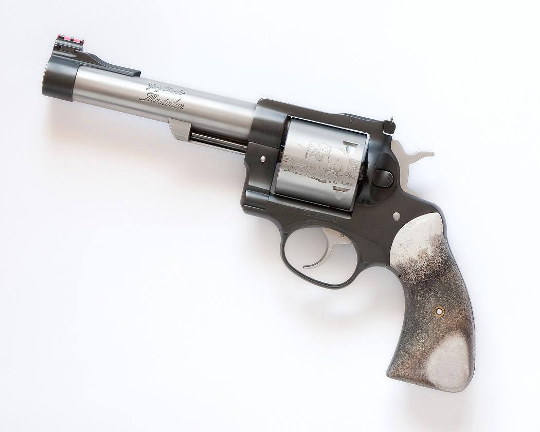 A gun that is on top of the floor.