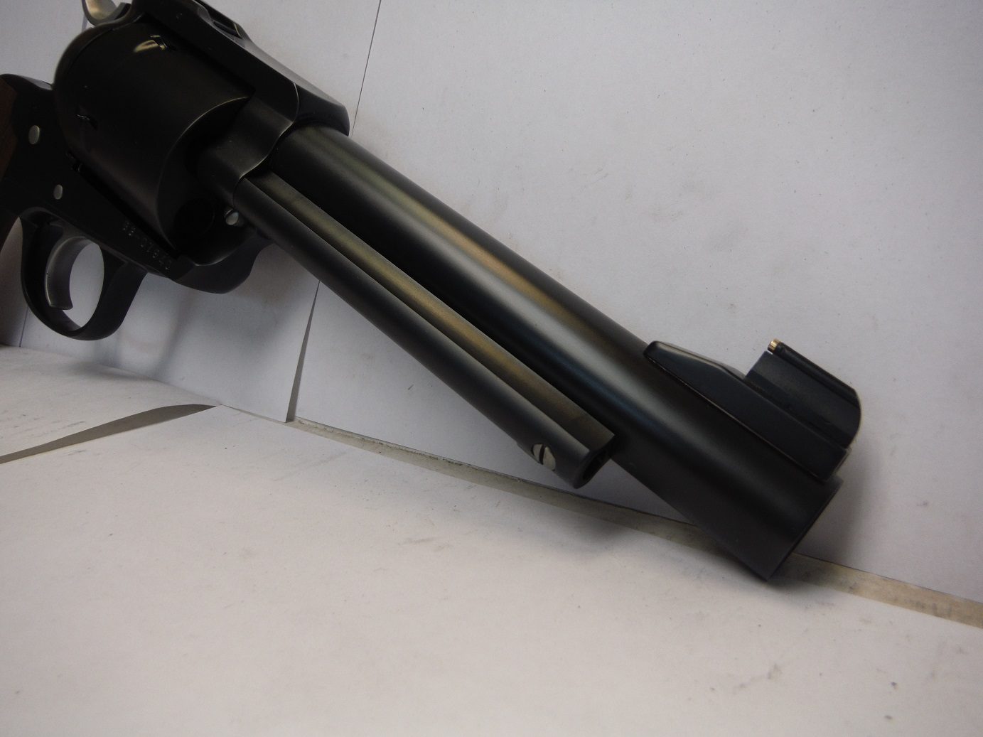 A gun that is sitting on top of a table.