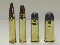 new ones_small A group of four bullet casings sitting side by side.
