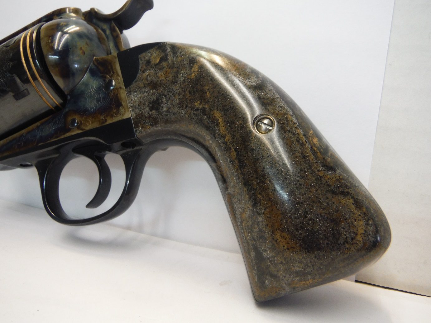 A gun that is sitting on the ground.