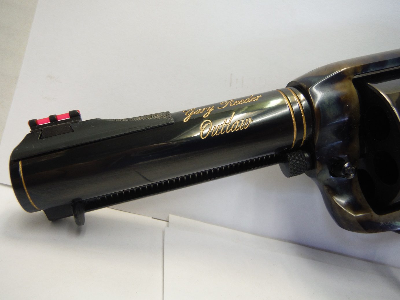 A black blow dryer sitting on top of a wall.