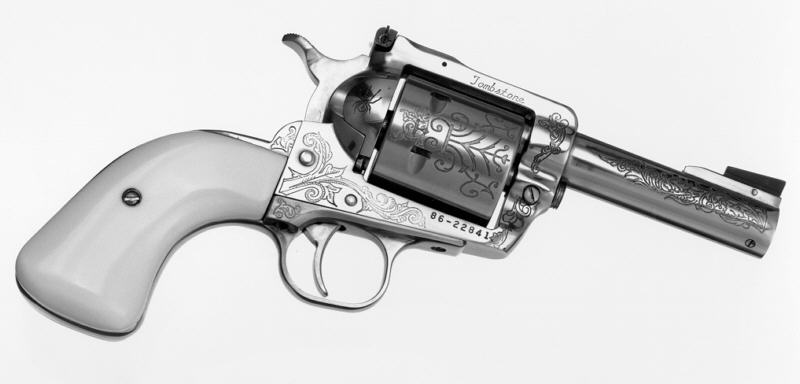 pistol_parlor_f A close up of the barrel on an old western style revolver.