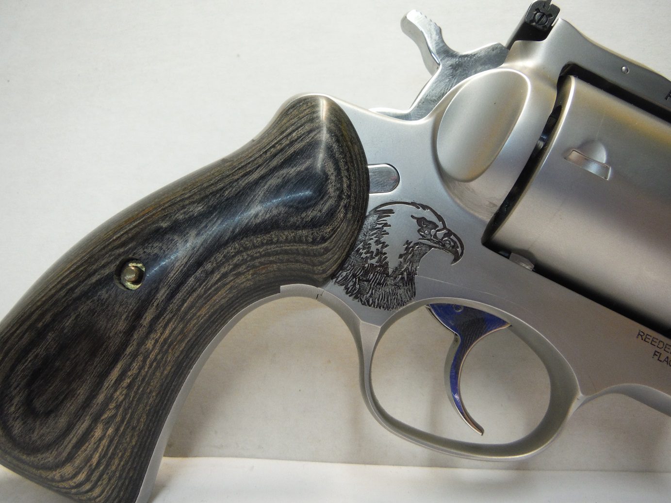 A close up of the handle on a gun