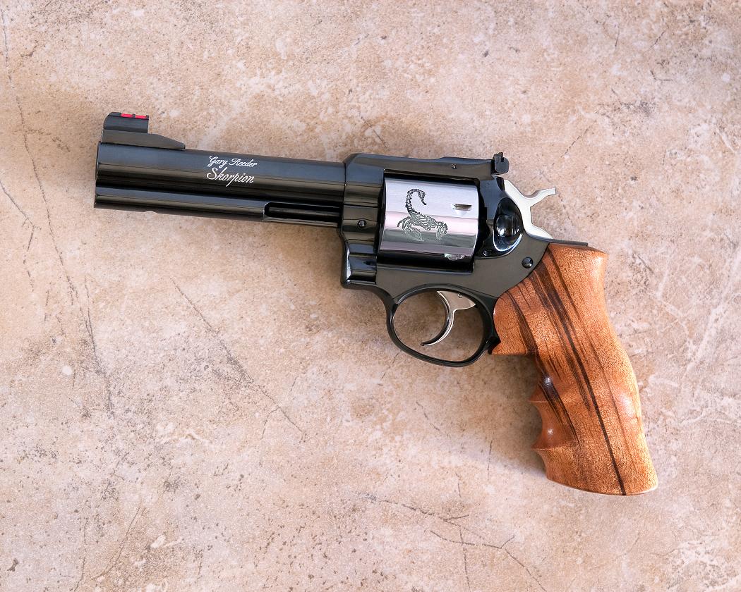 A gun that is laying on the ground.