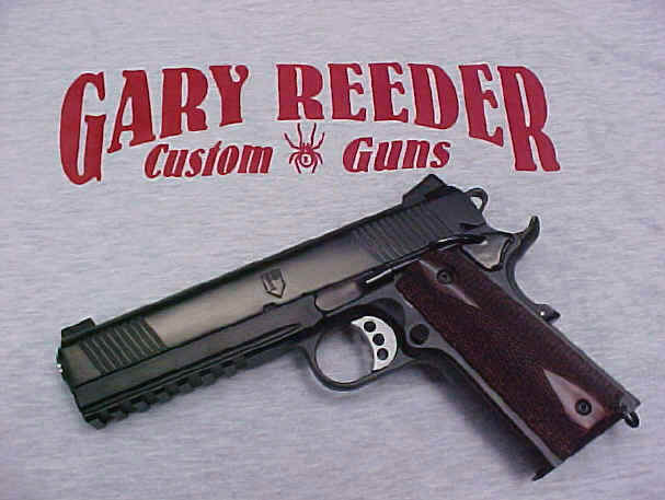 sprgfld1 A gun that is laying on top of a t shirt.