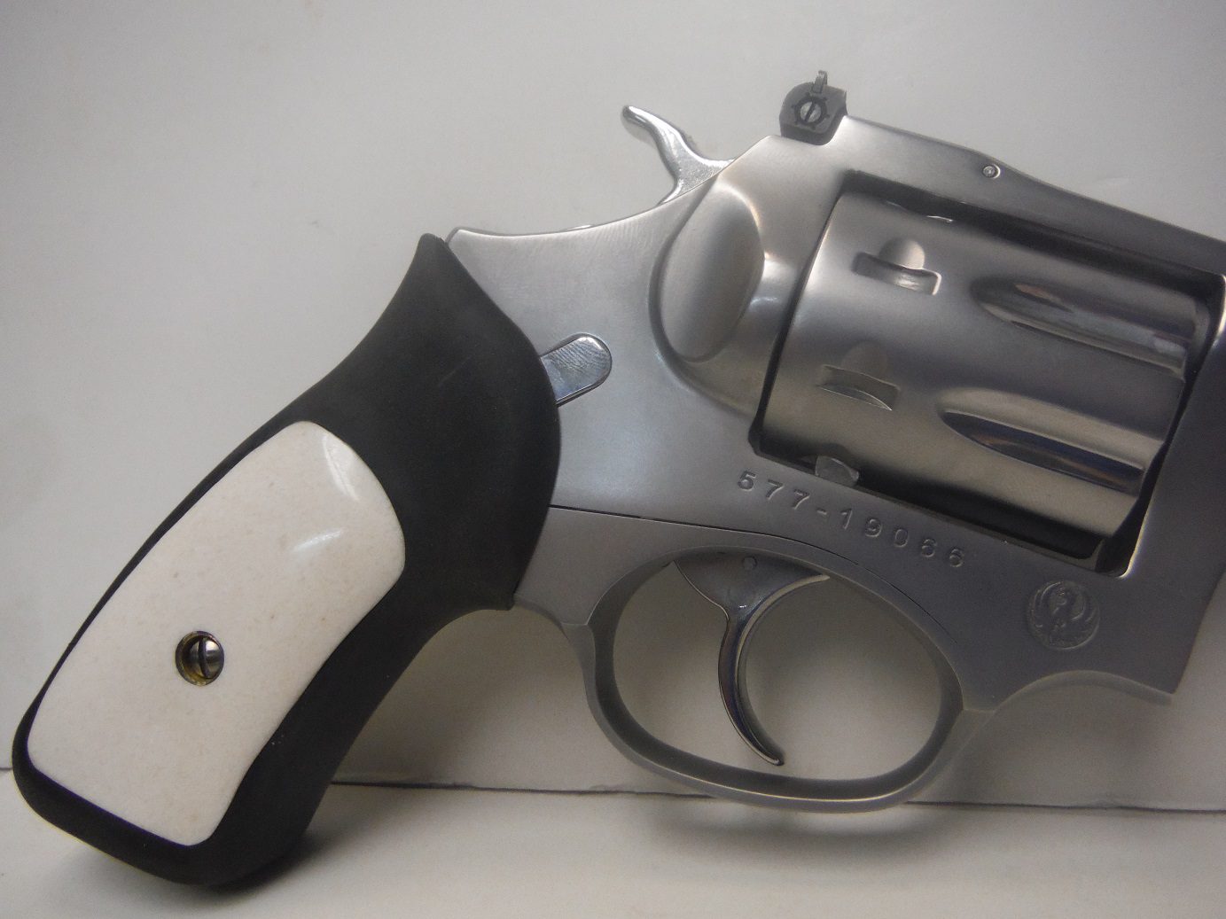 A gun that is sitting on the ground.