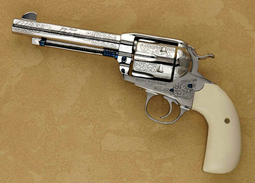 trail_rider2 A silver and white revolver with the handle up.